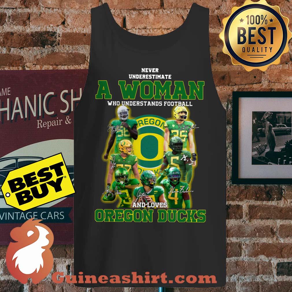 Never underestimate a woman football and loves Oregon ducks Signature tank top
