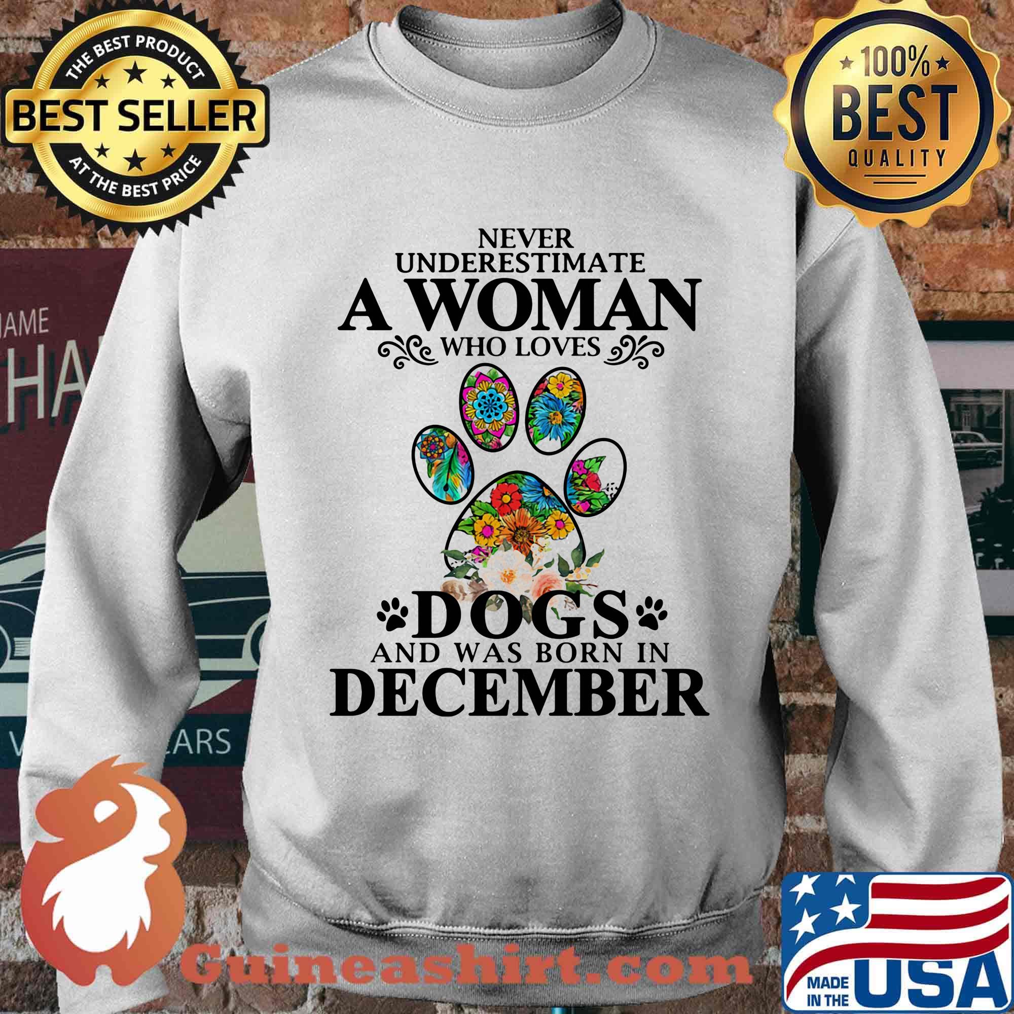 Never underestimate an old woman who loves dogs paw and was born in december s Sweater
