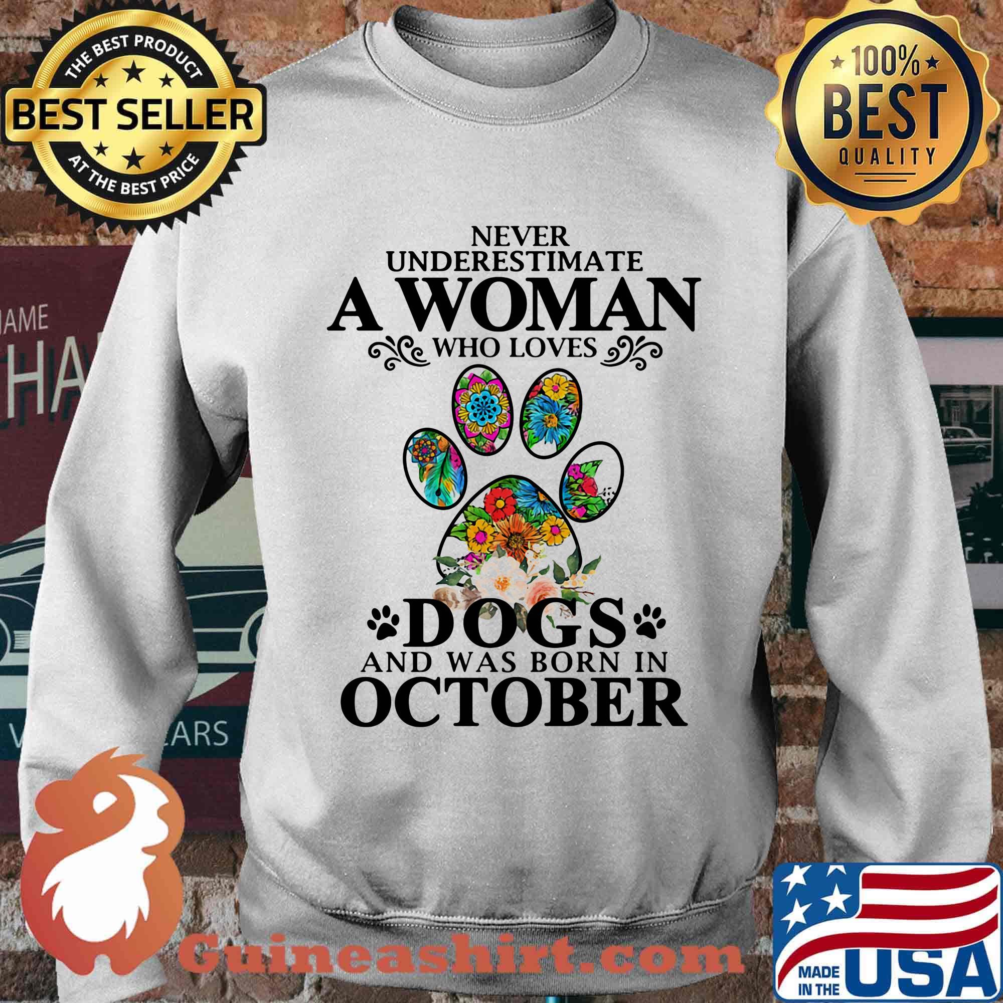 Never underestimate an old woman who loves dogs paw and was born in october s Sweater