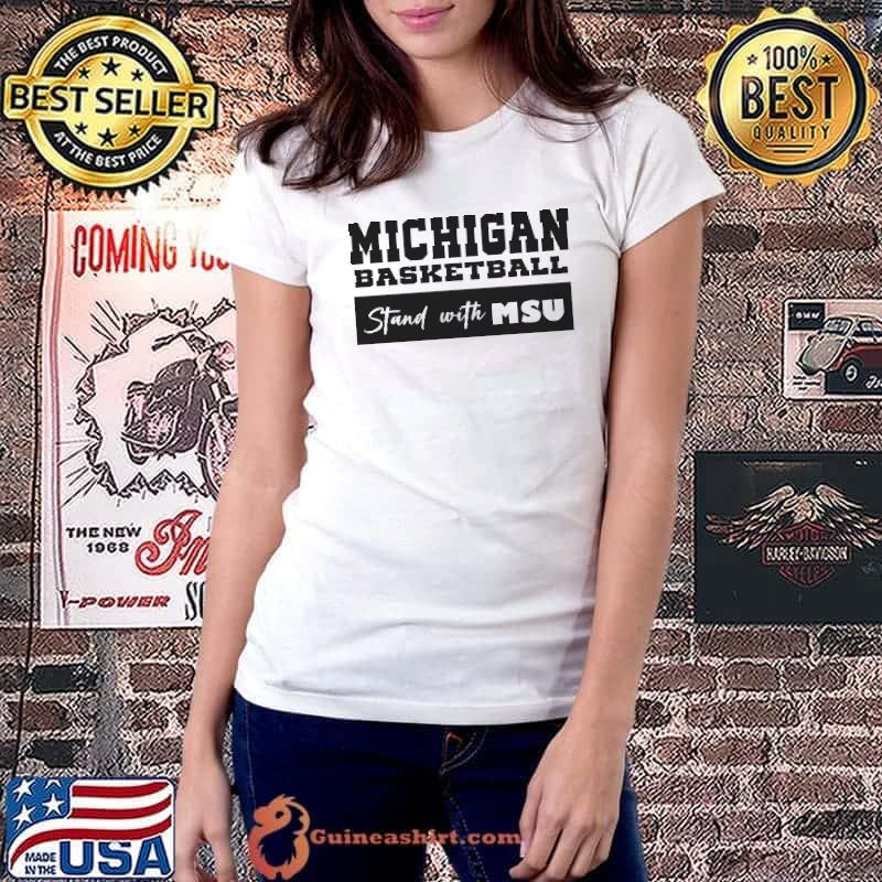 Michigan basketball stand with MSU shirt