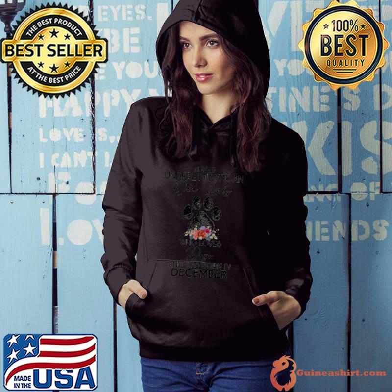 Never underestimate an old lady who loves dogs and born at December flower s Hoodie