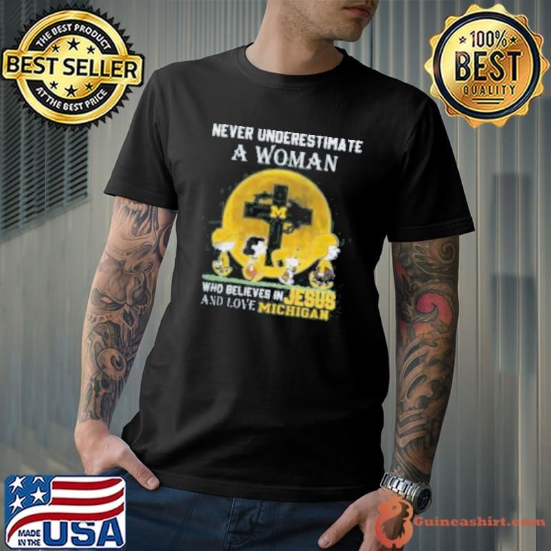 Peanuts Characters Never Underestimate A Woman Who Believes In Jesus And Loves Michigan Wolverines Shirt